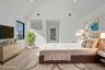Spacious retreat with vaulted ceilings and large windows, dual walk in closets and primary bath. Virtually Staged.