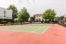 View of tennis court featuring community basketball court