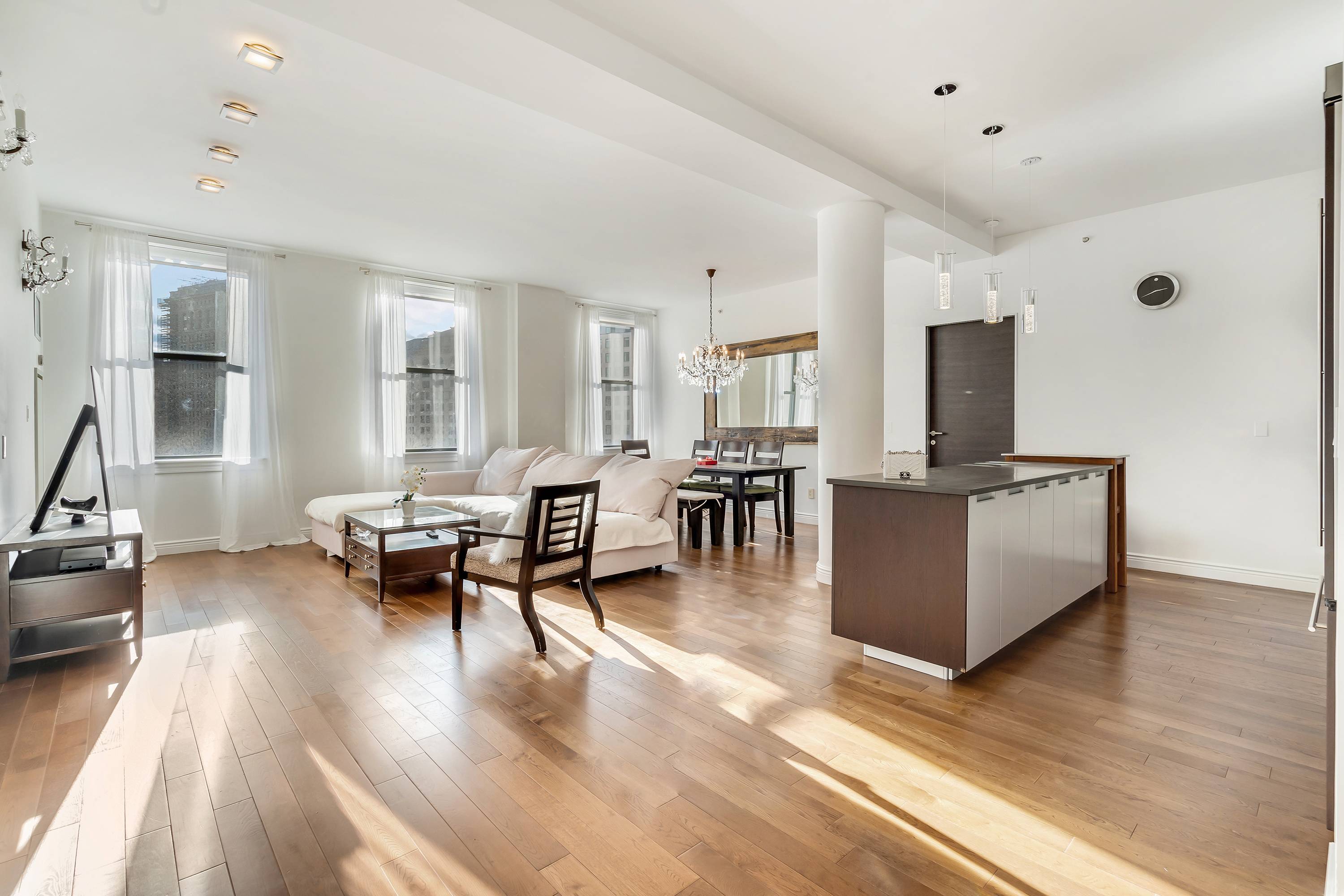 Unobstructed Madison Park views greet you in this sun splashed loft like apartment at The Grand Madison.