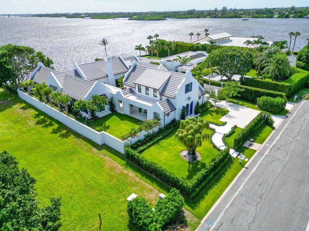 This newly constructed 2023 Dutch Colonial residence, situated in the secluded Ibis Isle, was built by Mark Albright of Albright Construction and features broad open spaces and 100 ft of ...