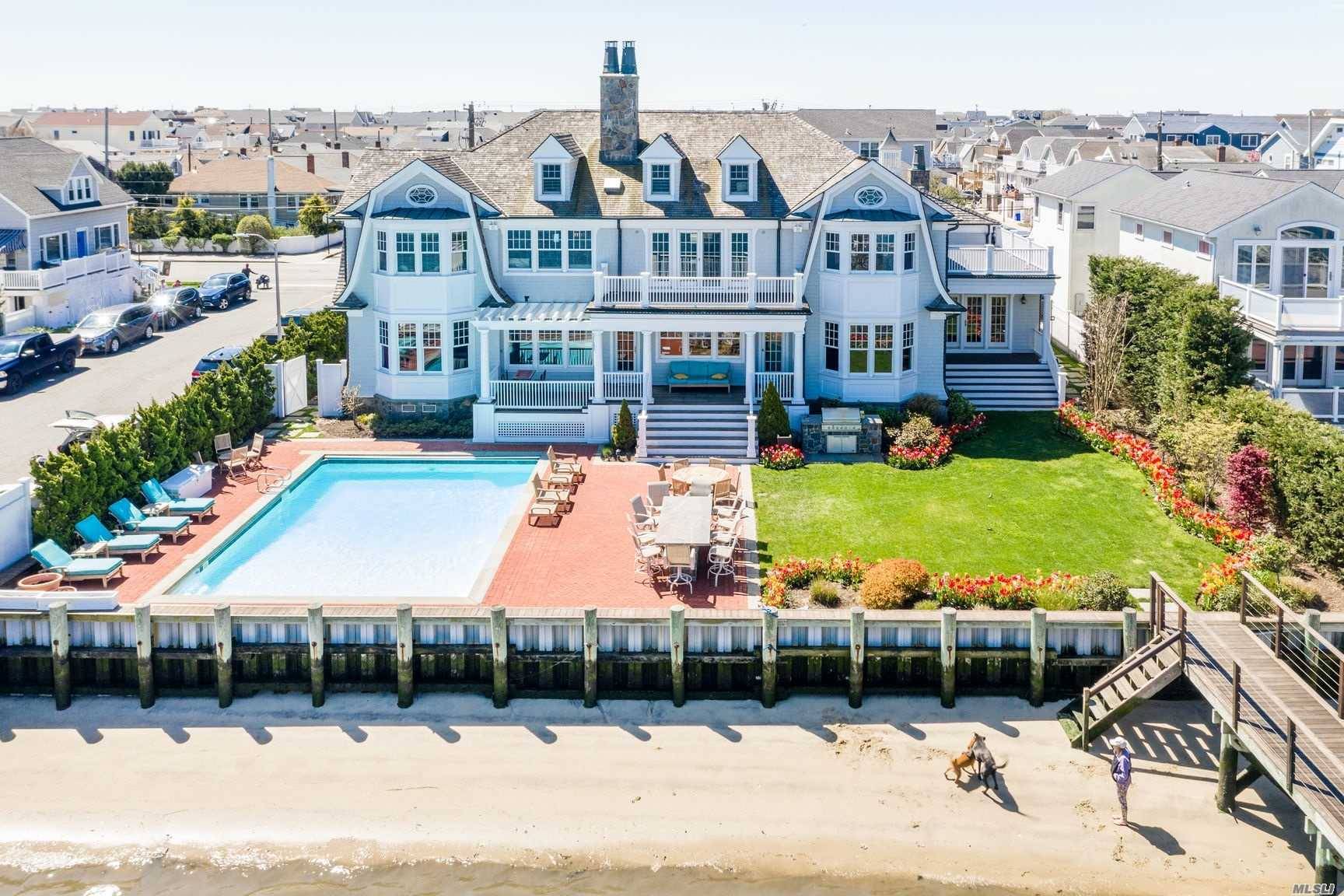 Spectacular Hamptons Like Mansion Located On Reynolds Channel With Picturesque City Skyline Views amp ; Amazing Sunsets.