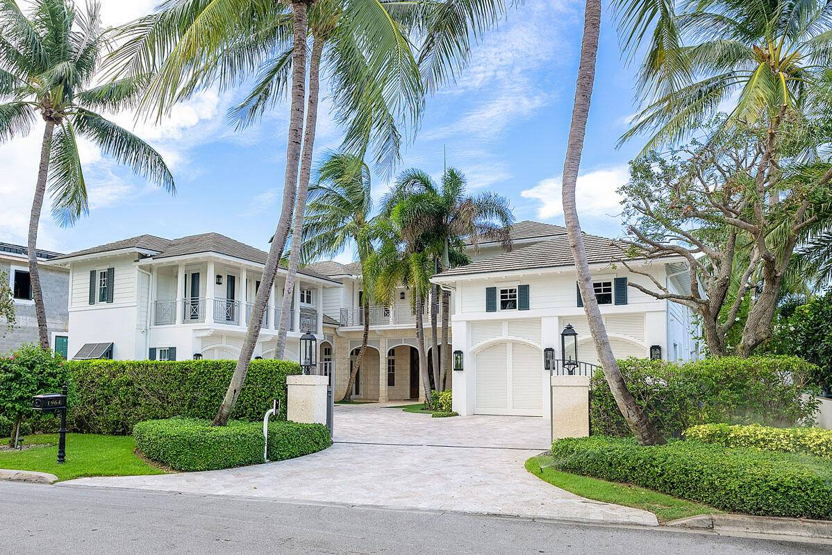 Welcome to 1964 Royal Palm Way, an exquisite estate on an oversized Intracoastal property, offering an impressive 100' water frontage within the prestigious Royal Palm Yacht Country Club.