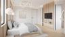 A thoughtfully designed upstairs ensuite bedroom with clean-lined millwork, warm natural tones, and integrated media wall detailing. Complete with a p