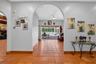 Grand Foyer with Ceramic Floors Throughout and Views Through the Living Room to the Swimming Pool