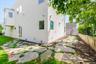 Back of house with stucco siding and crawl space