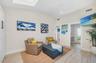 The Casita featuring the sitting area, TV and doorway to the half bath