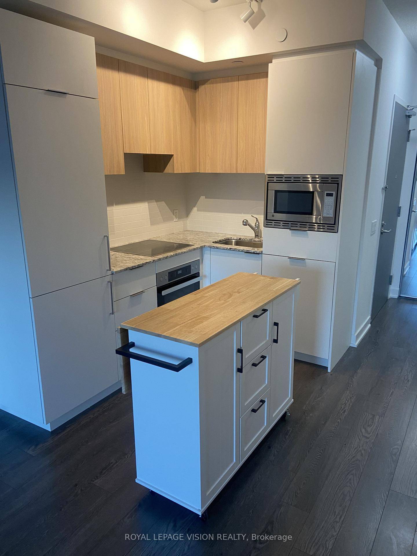 Kitchen Center Island, One bedroom Palm model 513 sq ft per builders floorplan balcony, rare huge bedroom that fits a king bed, all wood ceramic floors no carpet, one parking ...