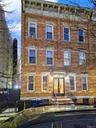 Italianate house featuring brick siding