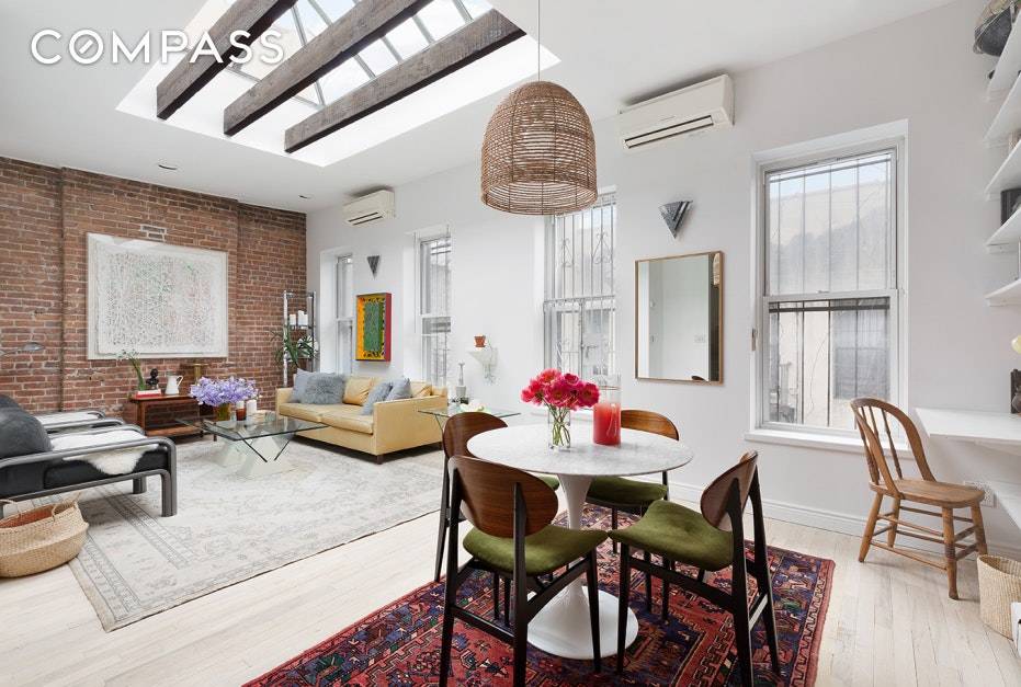 Tastefully renovated, while retaining its pre war charm, this sun flooded top floor two bedroom home is a true Lower East side gem.