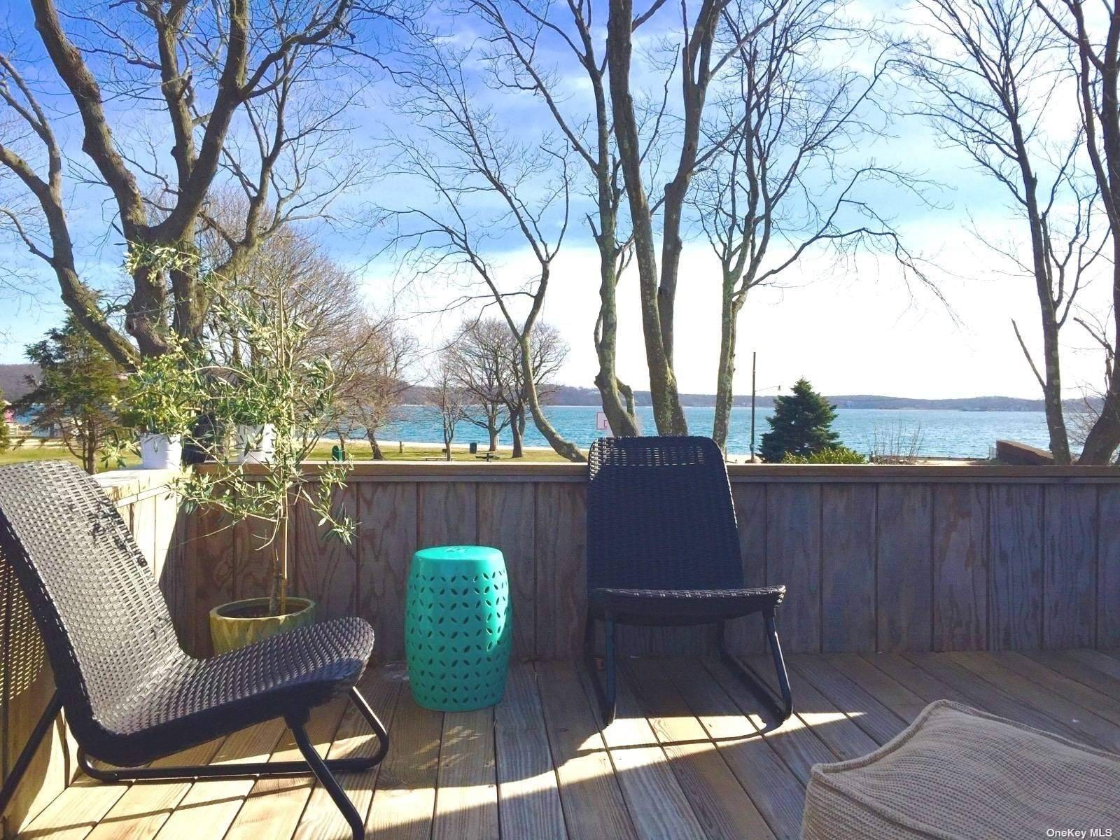 Greenport village 5 bedrooms, 2 baths with sweeping Water Views, adjacent to 6th St bay beach amp ; park.