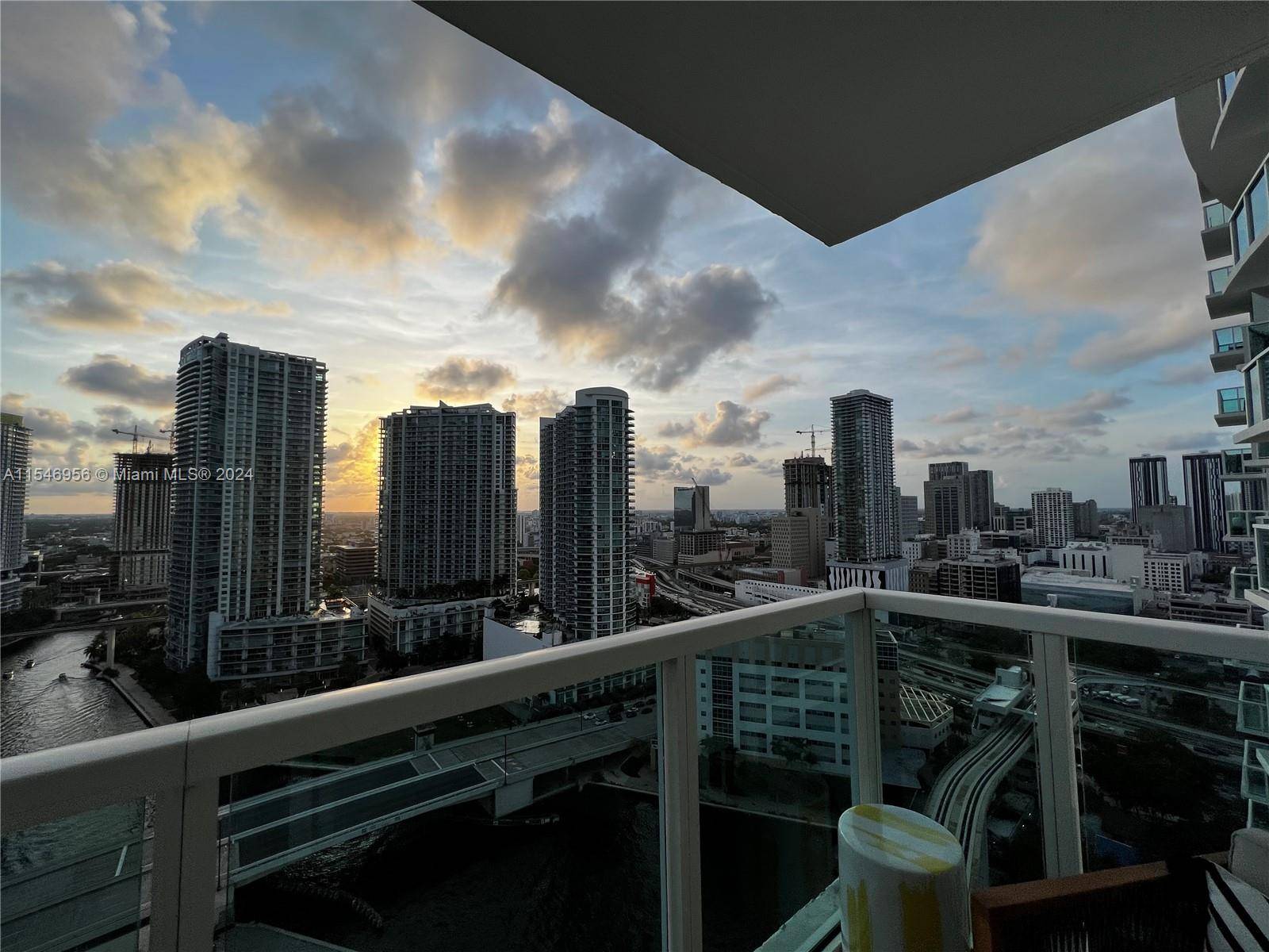 A chic 2BD 2BA Luxury Apartment with Breathtaking River Sunset Views in Prime Brickell Location.