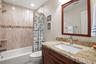 Ensuite bath in second bedroom with tub/shower combination