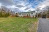 Front of house, blacktop drive and cabana