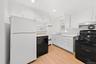 Kitchen with range and dishwasher, new vinyl luxury flooring and freshly painted
