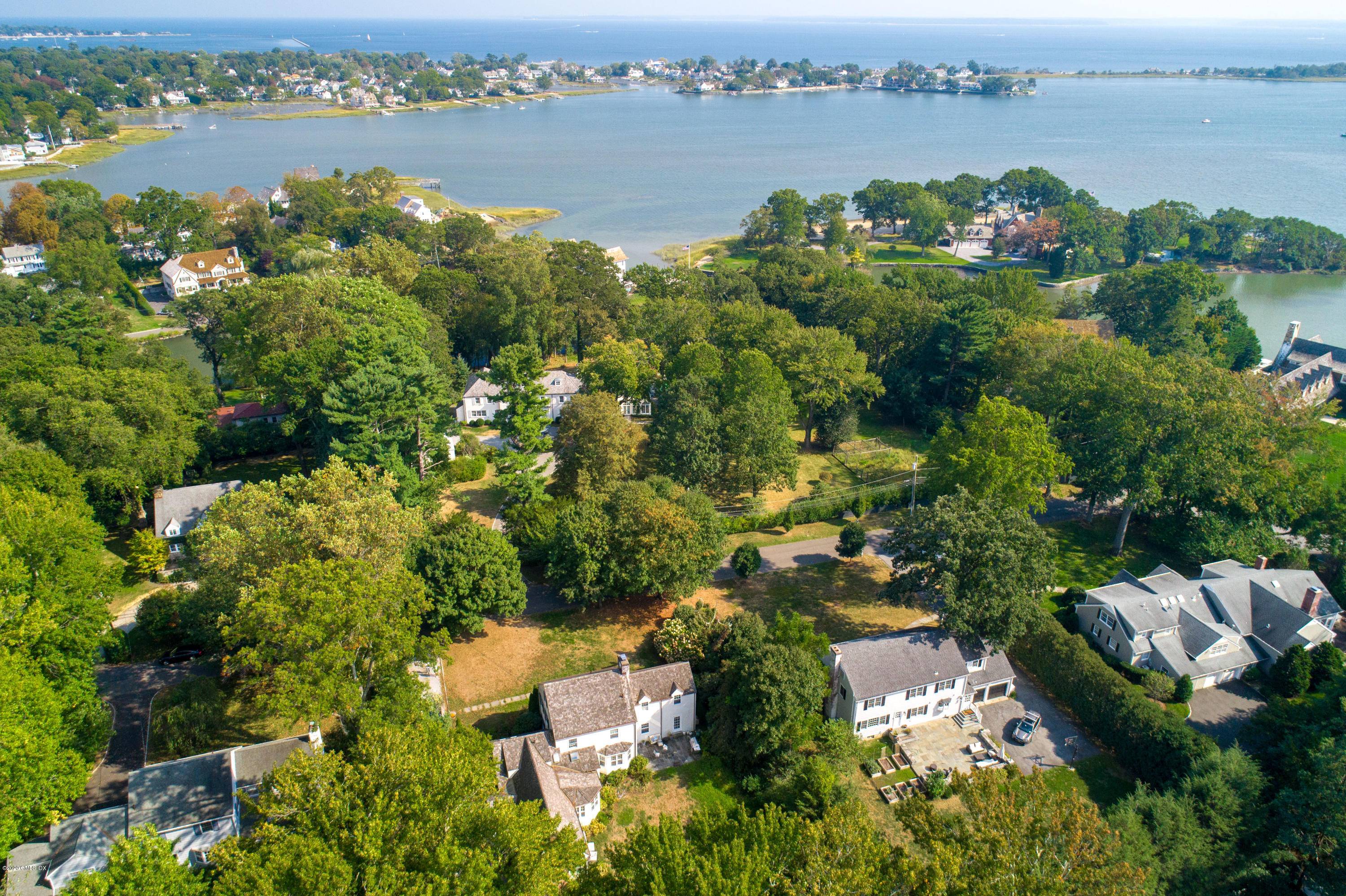Fabulous location at the end of coveted Meadow Road with deeded access to the private Willowmere Association beach and dock.
