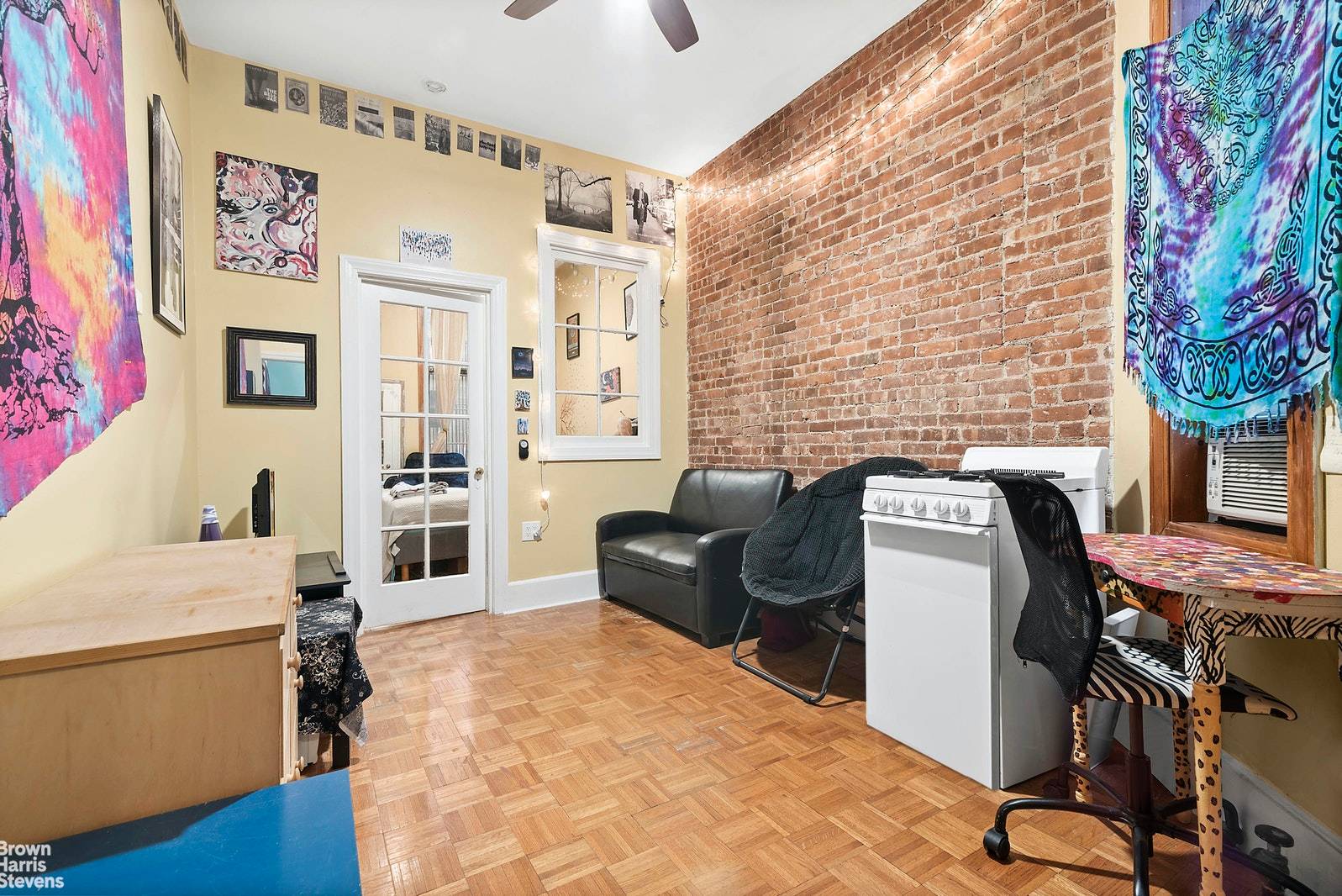 Apartment features sunny western exposure over looking Sullivan Street, just refinished hardwood floors, full sized kitchen appliances, tiled bathroom, and ample sized bedrooms easily accommodating queen beds plus additional furniture.