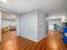 Hallway featuring wood finished floors and recessed lighting