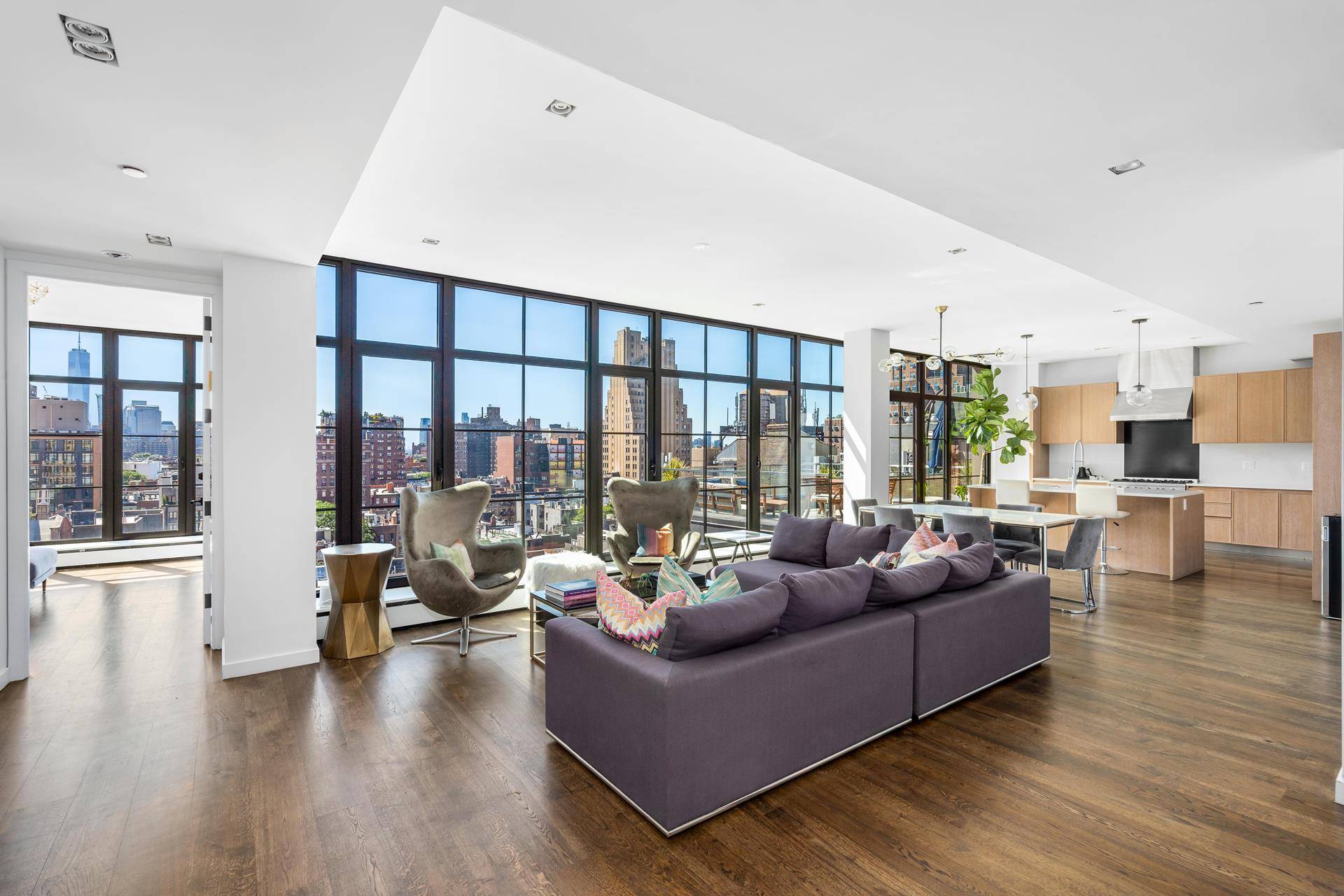 Enjoy sweeping downtown views through nearly 50 feet of floor to ceiling casement windows or from your own private rooftop.