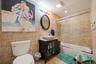 Bathroom with tile walls, shower / bath combination with glass door, vanity, tile patterned floors, and recessed lighting