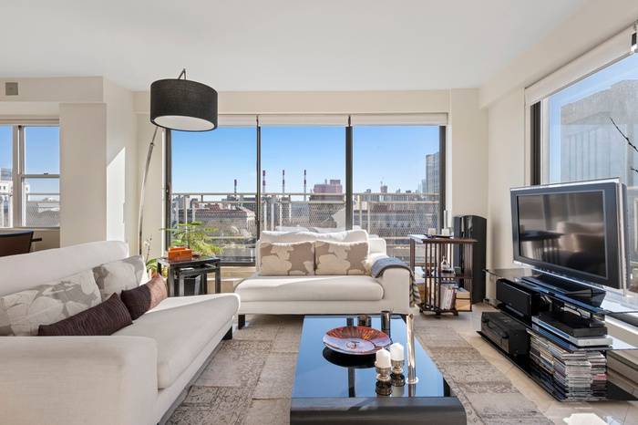 A luminous corner penthouse boasting views of the East River and Empire State Buildings, this 2 bedroom, 2 bathoom co op is classic Upper East Side luxury personified.