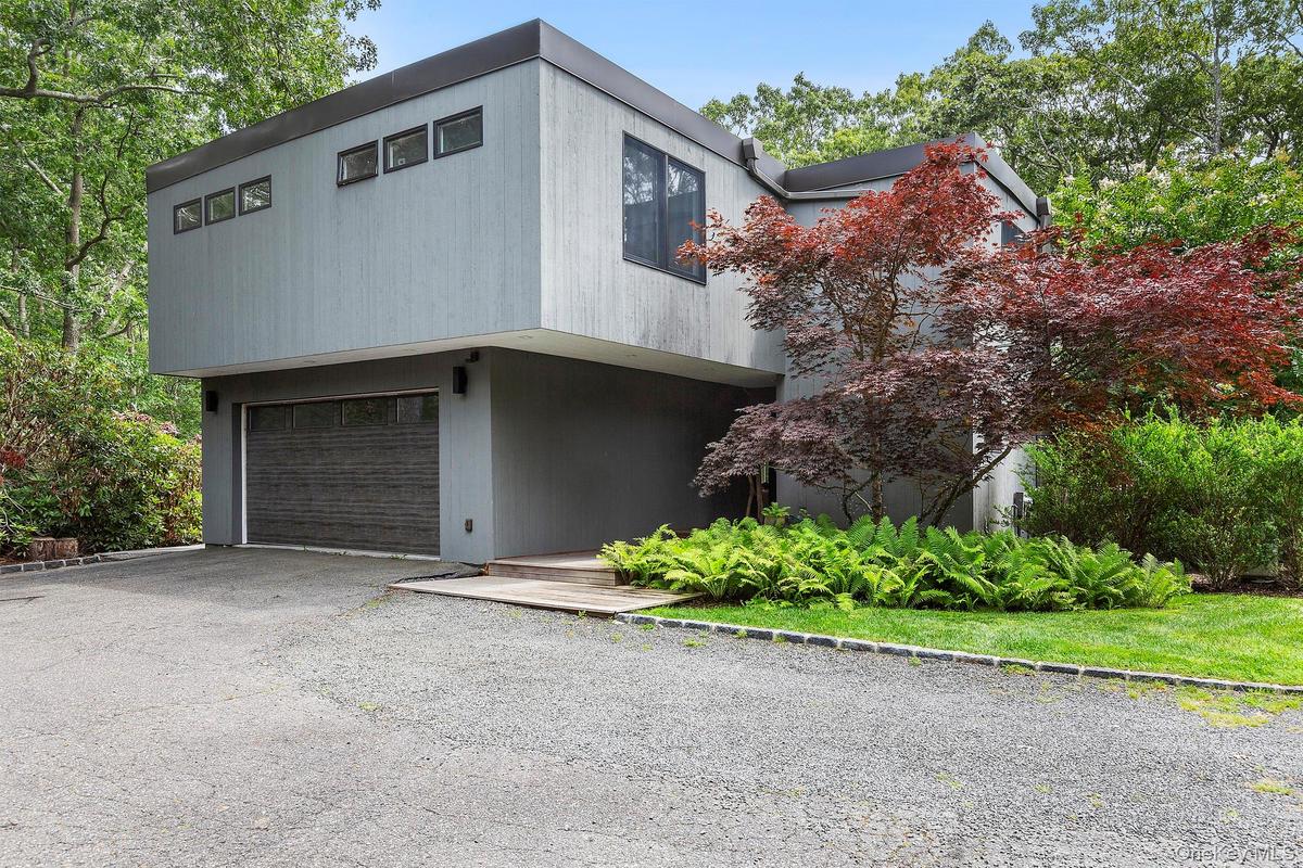 View of front facade featuring a garage