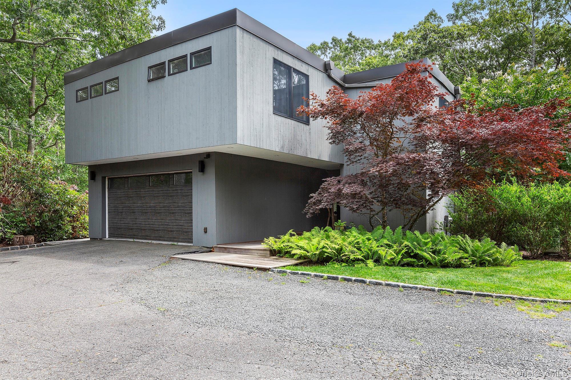 View of front facade featuring a garage
