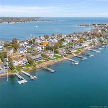 Nantucket style, direct waterfront AND a deep water dock, set right on Saugatuck Shores' Bermuda Lagoon.