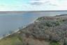 Aerial view of property's location featuring a nearby body of water