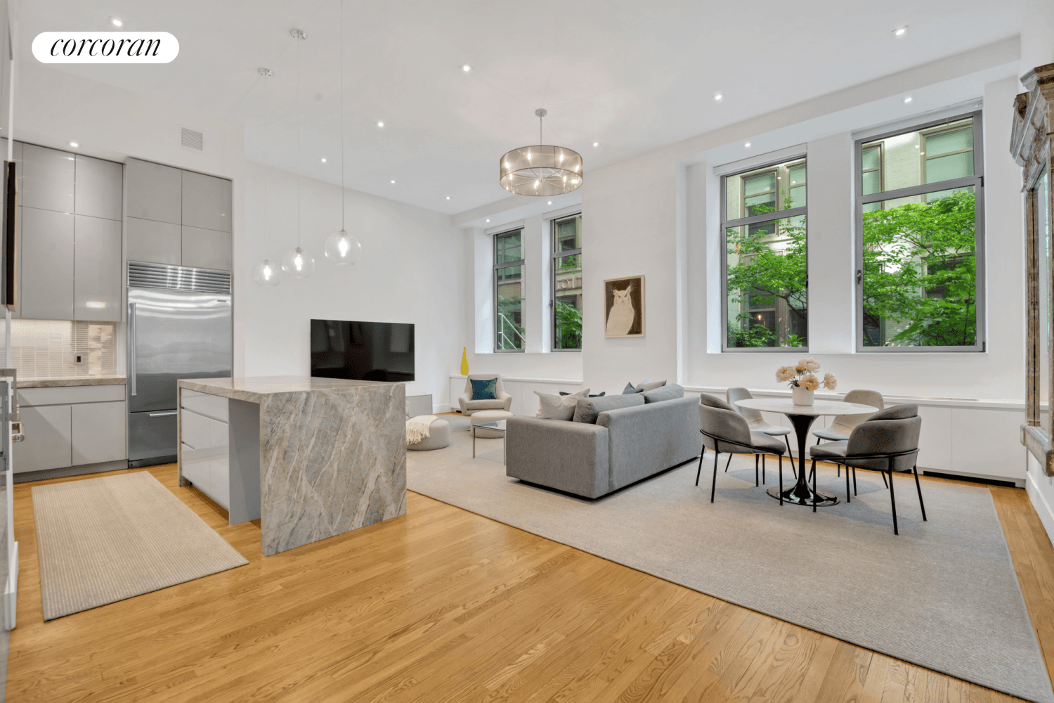 A stunning renovation of this loft condominium at the famed Chelsea Mercantile features 12'8 ceiling hights and a bright southern exposure to the lush landscaped private garden.