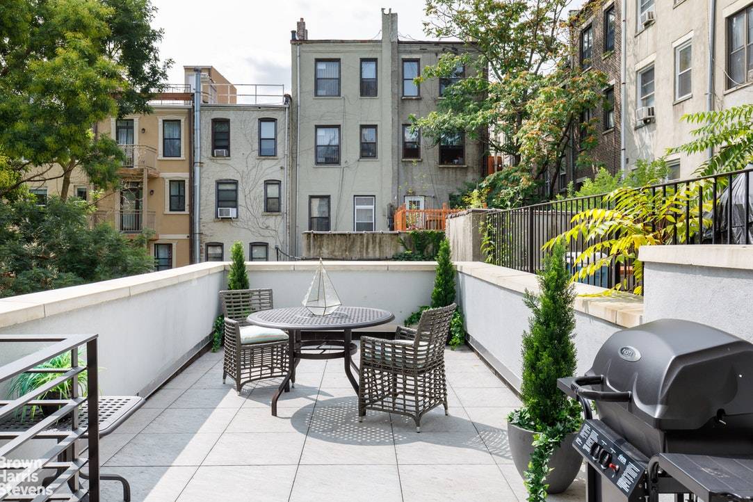 Welcome home to one of the most thoughtfully and attractively fully renovated historic homes in Harlem, one block from St.