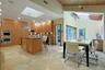 The spacious dining area creates a comfortable setting for casual meals with easy access to the surrounding patios.