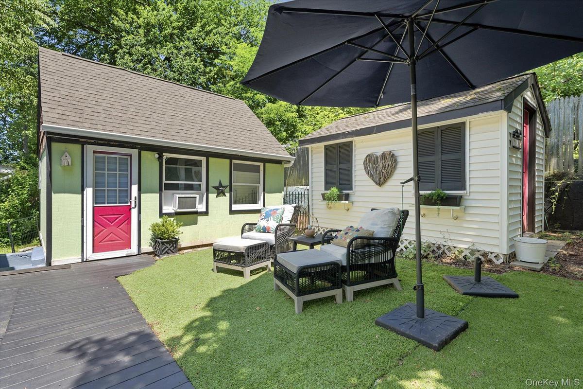 Outbuildings include a private workshop and garden shed