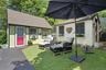 Outbuildings include a private workshop and garden shed