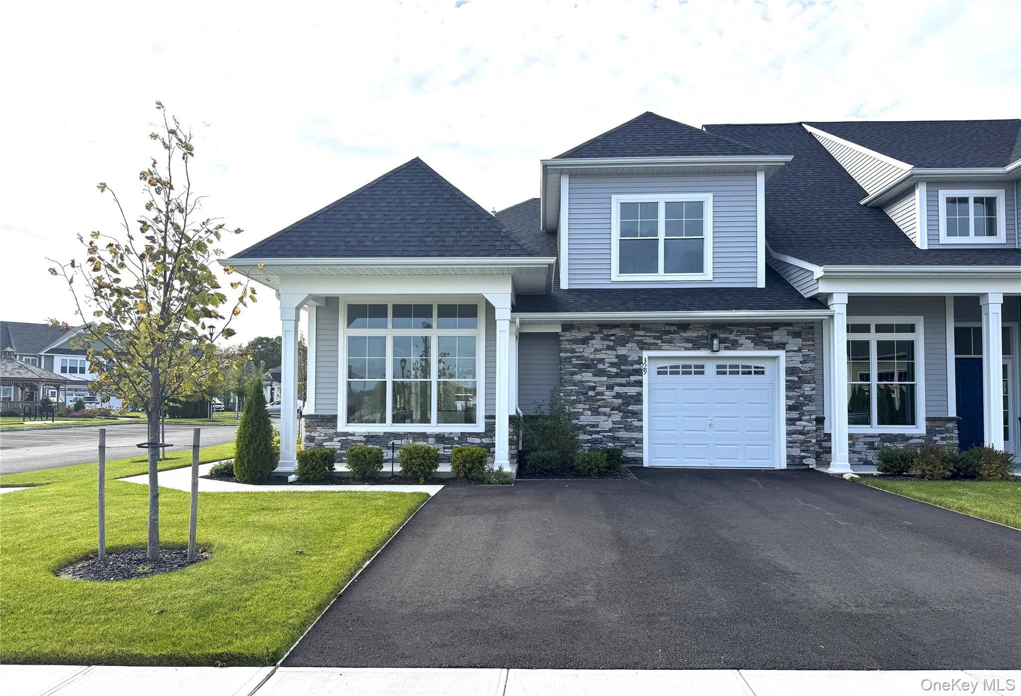 Welcome to Country Pointe Meadows, where modern elegance and timeless comfort meet in this beautifully designed end unit townhome.