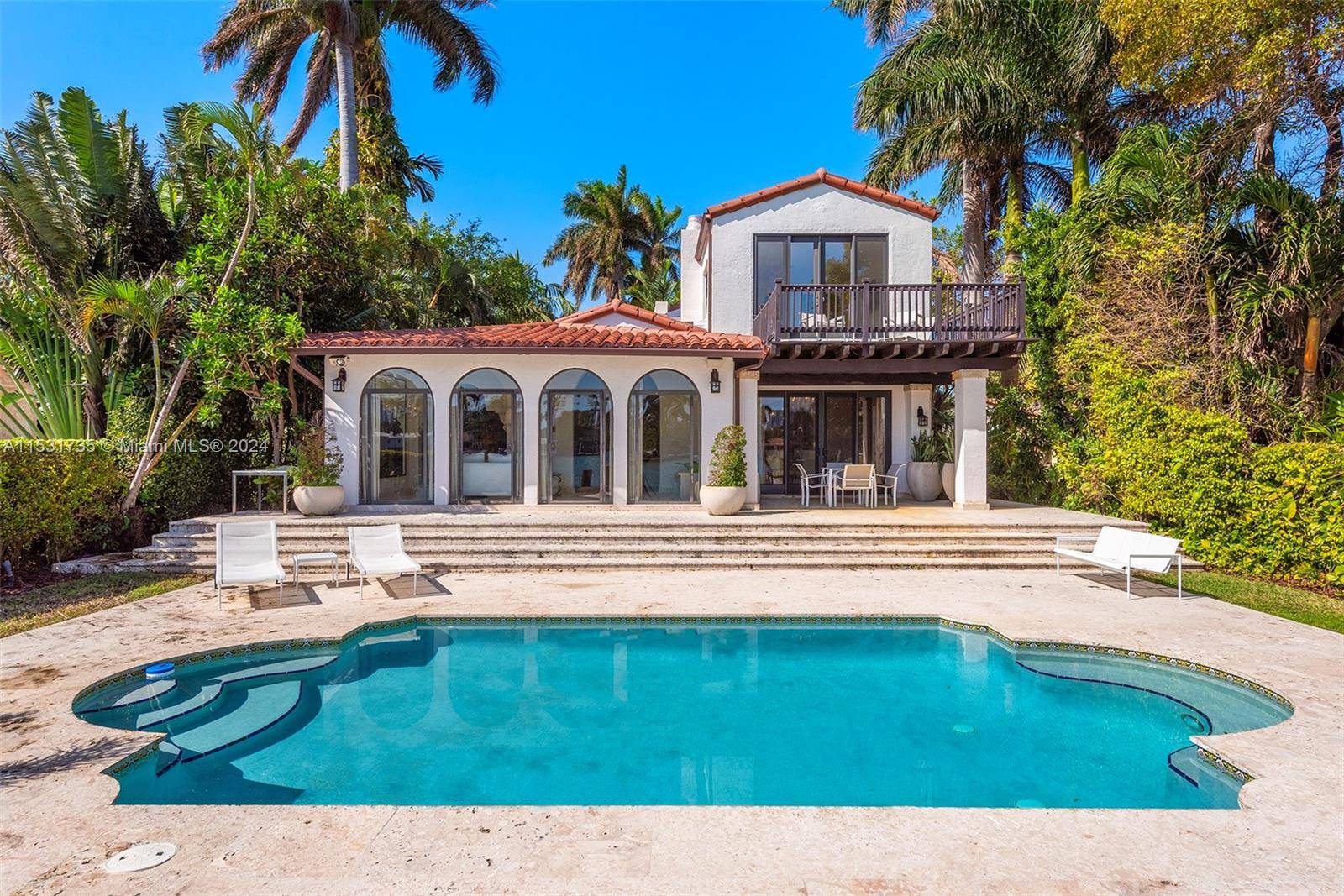 El Escape an Italian Villa nestled within the lush Venetian Islands features stunning, original architectural details and panoramic vistas of Biscayne Bay from every angle !