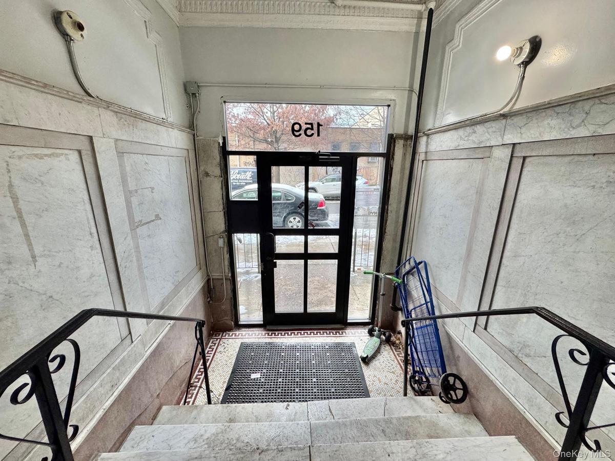 Entrance foyer featuring crown molding