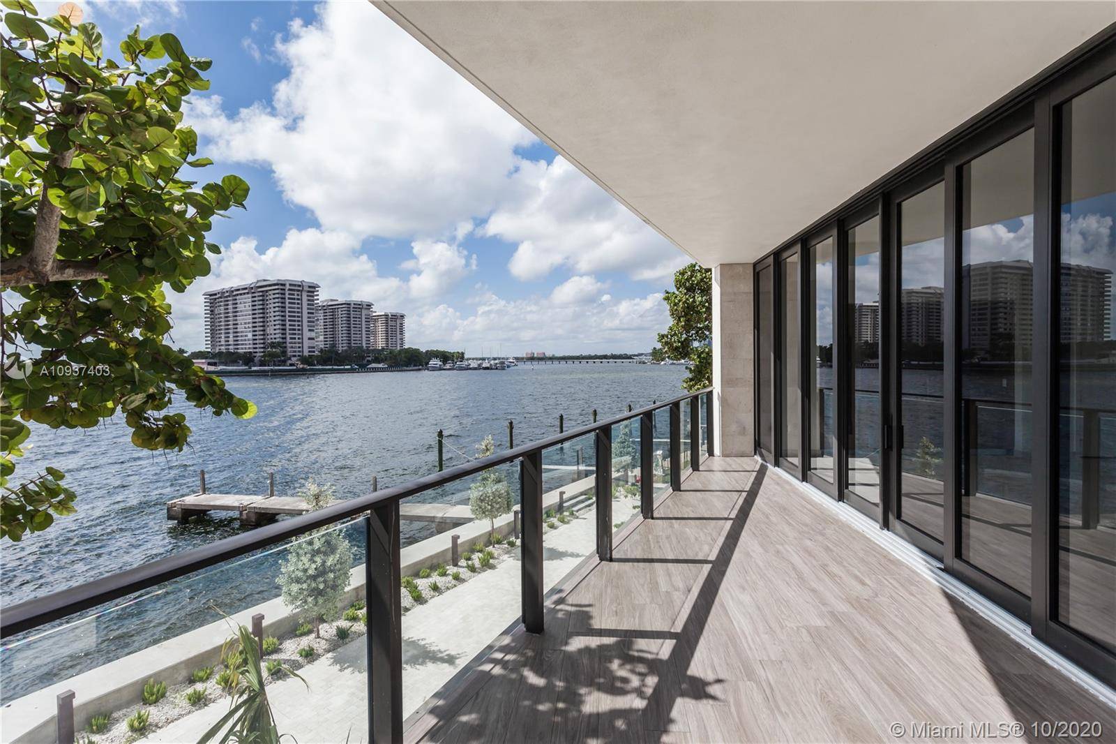 Stunning water views envelope this spacious four bedroom, five and a half bath residence at The Fairchild Coconut Grove.