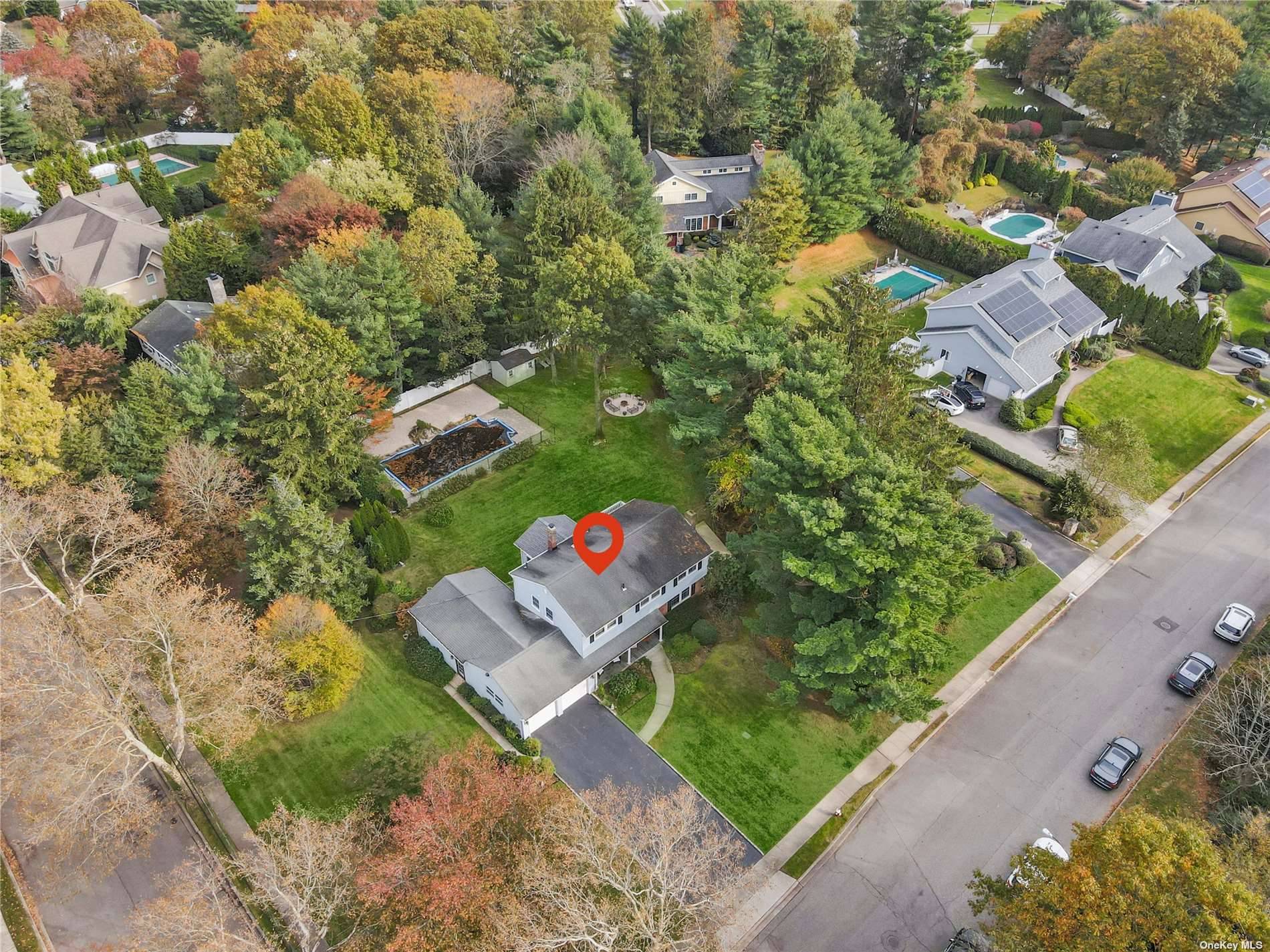Designer Home in North Syosset on over half acre of manicured property with Country Club Property amp ; Pool !