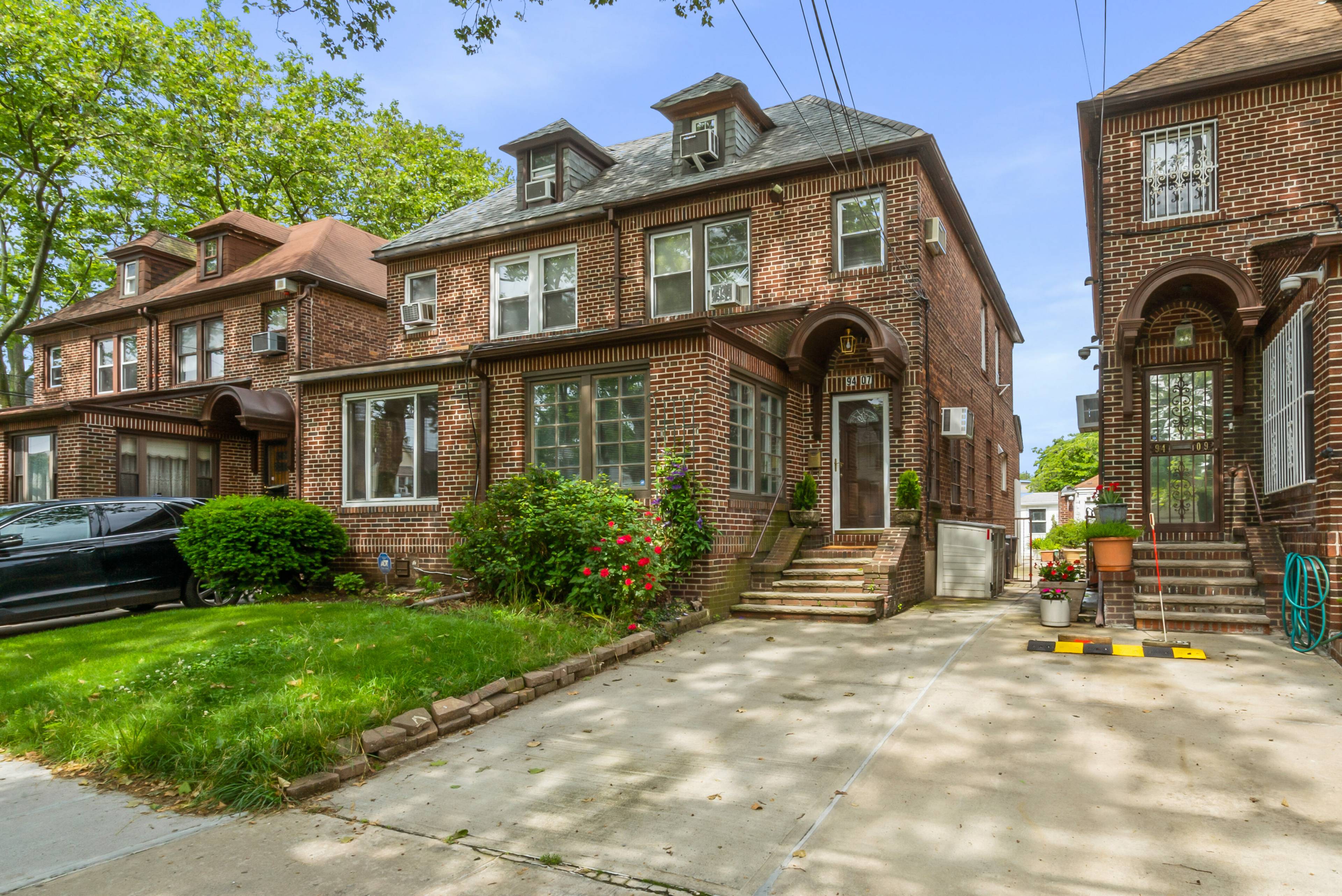 Spacious, sunny and charming brick home in prestigious Forest Hills.