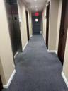 Hall featuring carpet and elevator