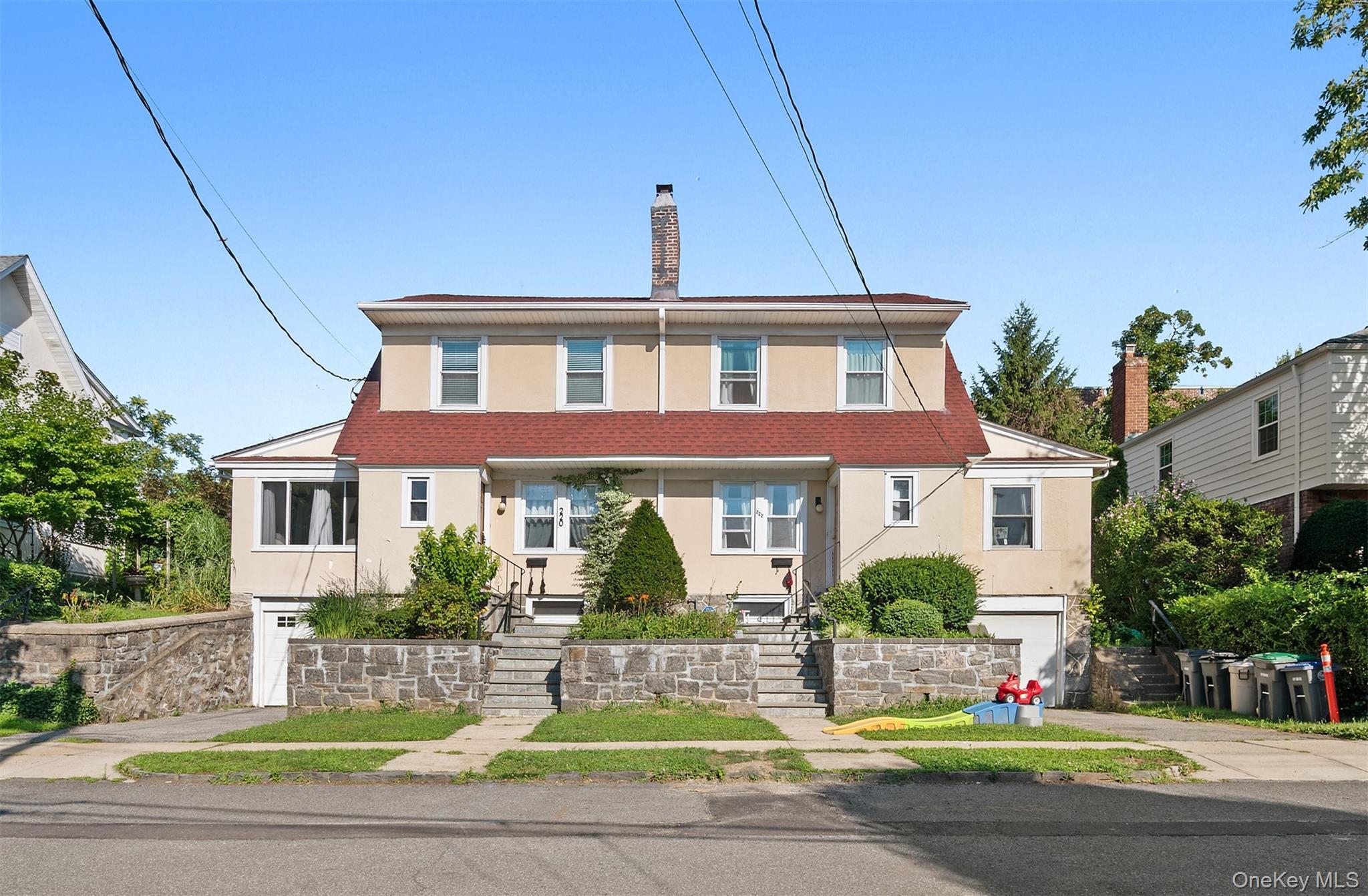 Check Out This Legal Two Family Home With Two Garages and Two Private Entrances