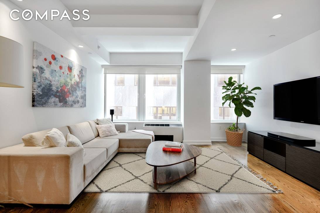 Sleek interiors and loft like proportions define this outstanding alcove studio in an amenity rich FiDi condominium.