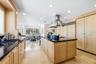 Kitchen has a spacious island and wine closet