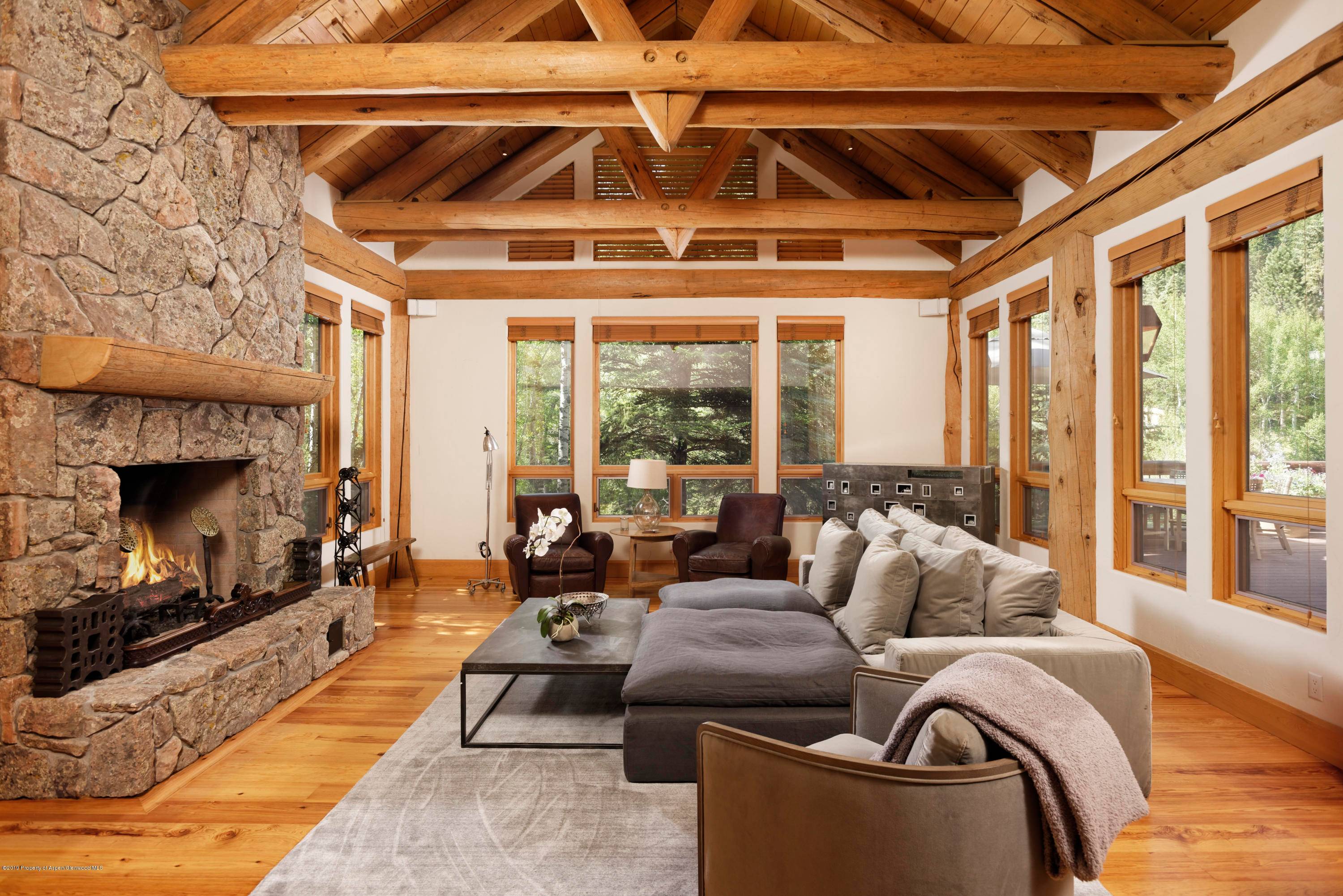 Enjoy an impeccably maintained 5 bedroom property that sits on the edge of the Roaring Fork River just outside of the Aspen core.