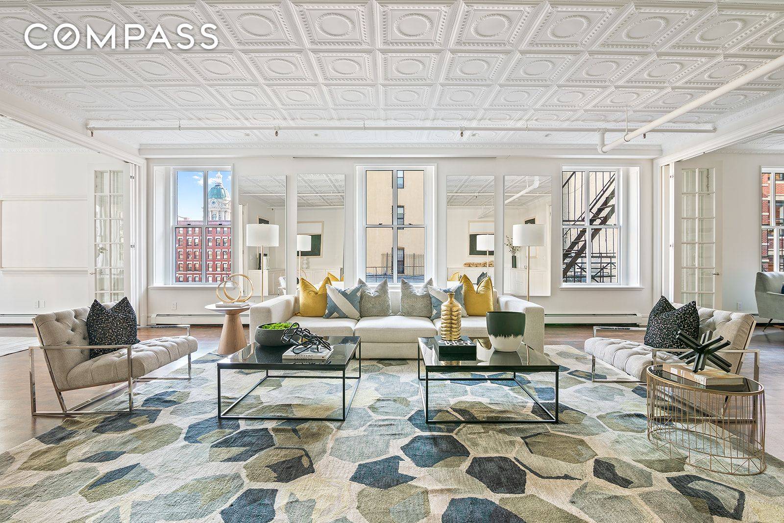 This elegant and expansive 3, 224 sq ft, 4 bedroom, 3 bathroom SoHo corner loft is flooded with natural light through 17 incredibly large windows.