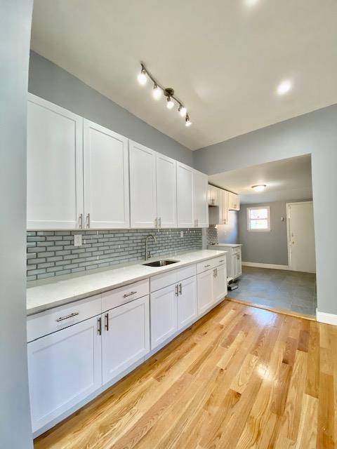 Beautifully reimagined inside and out, semi detached three bedroom, four and a half bathroom townhouse is a spacious indoor outdoor haven in the emerging Jamaica Center, Queens neighborhood.