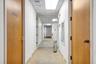 Hallway with a paneled ceiling