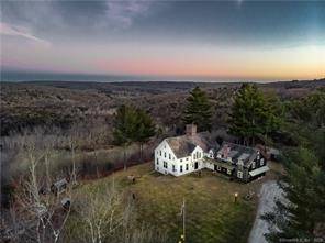Perched at one of Roxbury's highest elevations, with hypnotizing views, lies the Golden Harvest homestead of master builder Ed Cady.