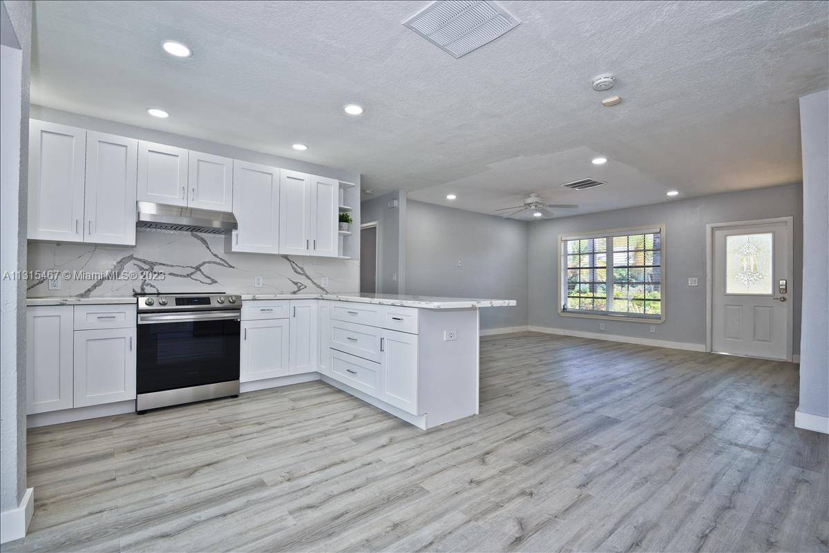 Attention investors ! Beautifully remodeled, bright and modern home with lush backyard and pool.