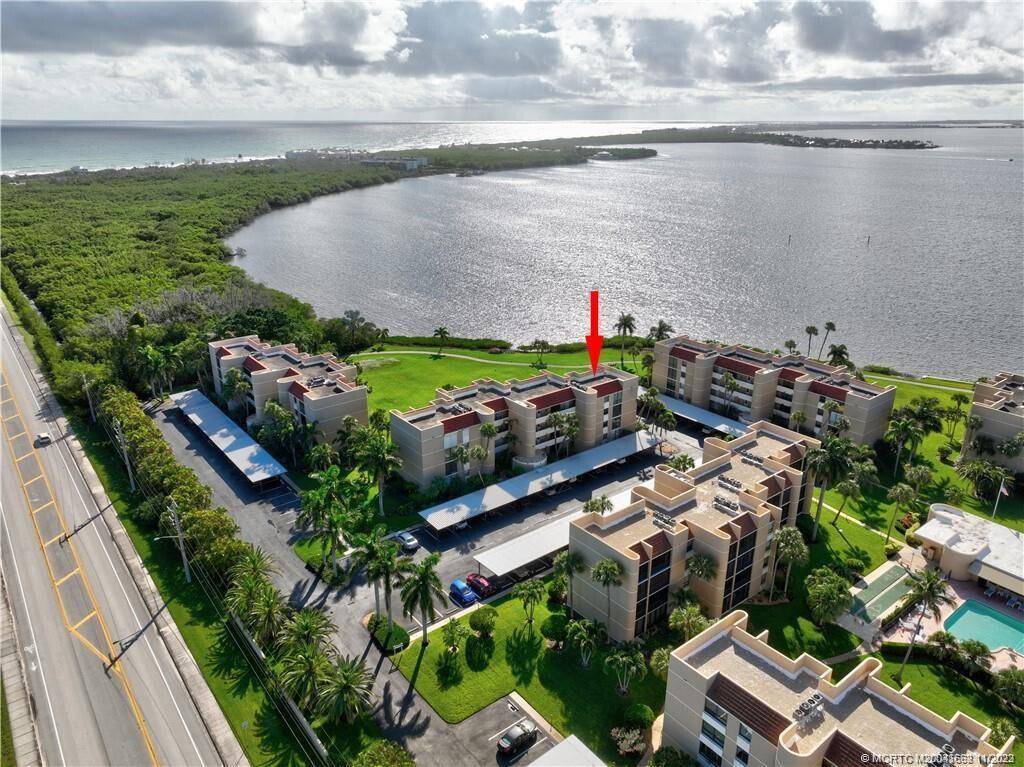 Enjoy the spectacular coastal views from your balcony in this light and bright waterfront corner unit residence in the desirable community of Fairwinds Cove.